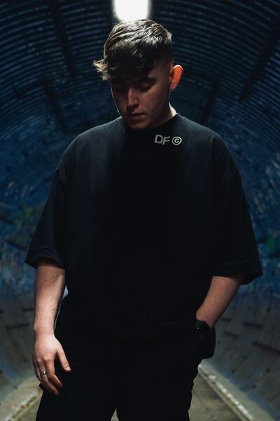 Modeā full length in a brick tunnel, blue tones